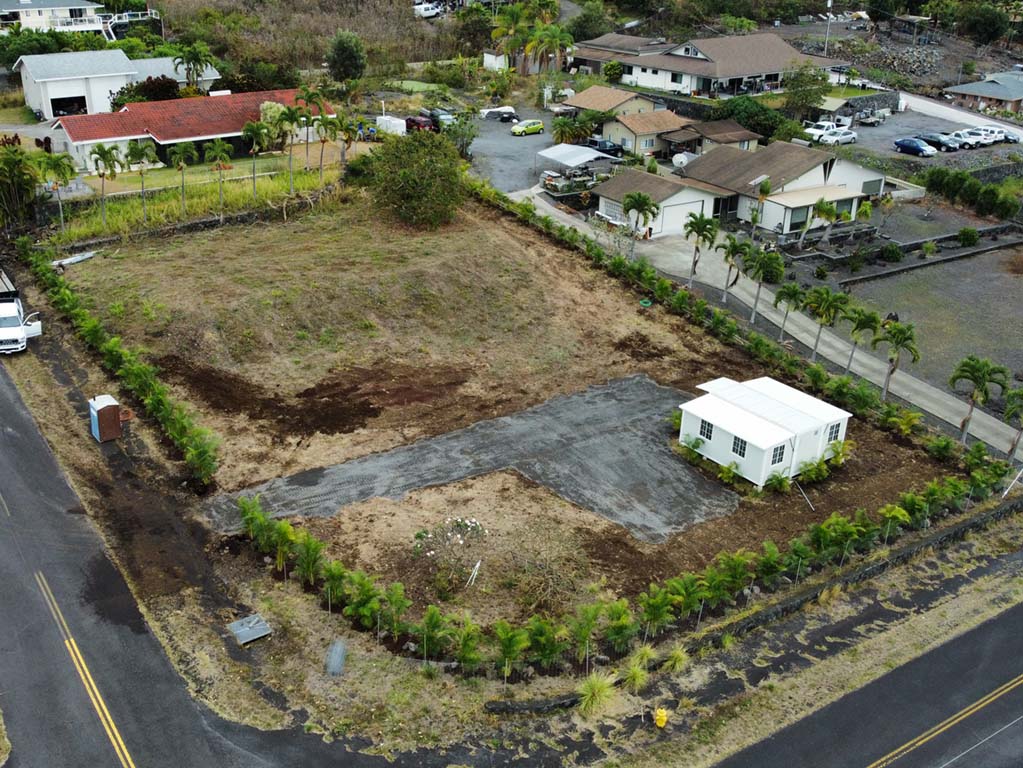 Hawaii landscapers installing aggregate for a driveway near Kailua-Kona