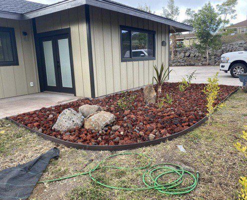 Hawaii flower bed with lava rock and vinyl edging landscaping kona.