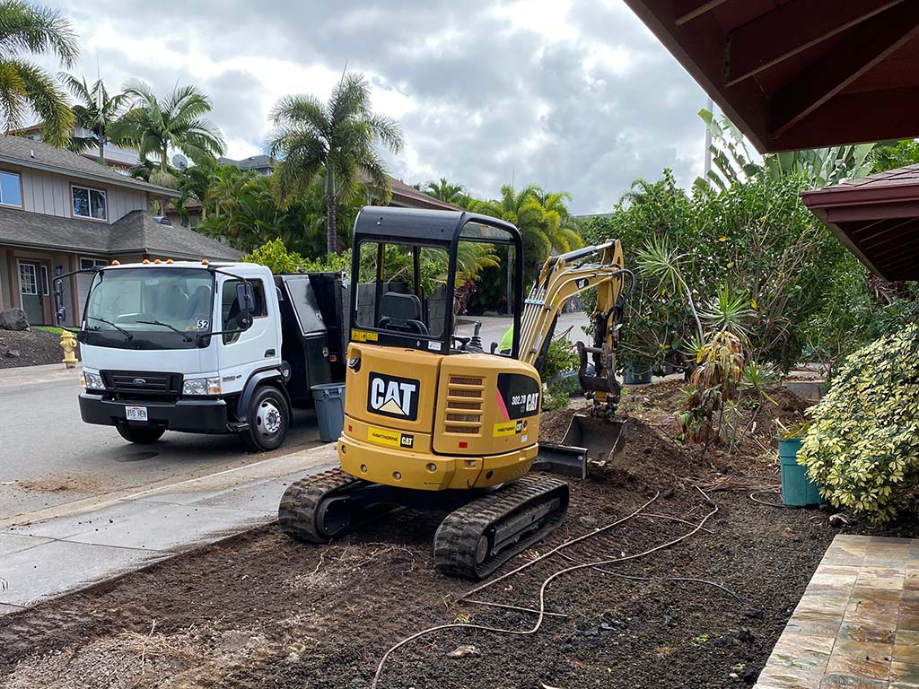 Big island landscaping company preparing the ground with an excavator.