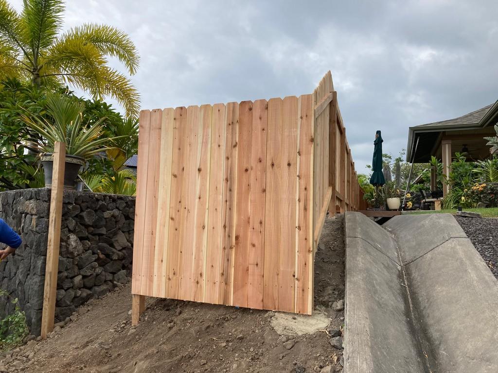 Nearly completed wooden fence install near Kailua-Kona. We also offer installation services for vinyl fence, aluminum fence, and chain link fence.