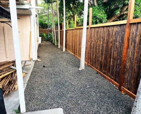 Post cinder aggregate and bamboo fence installation, Kailua-Kona, Hawaii.