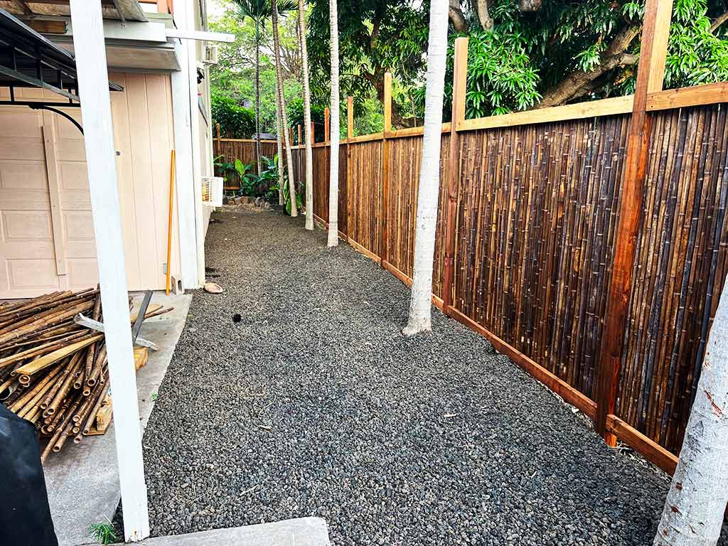 Post cinder aggregate and bamboo fence installation, Kailua-Kona, Hawaii.