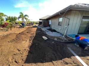 Big island excavation crew level and prepare the topsoil for sod.