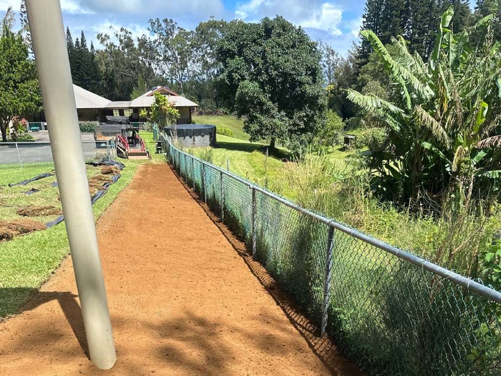 Hawaii lawn repair services included leveling the soil around the playground.