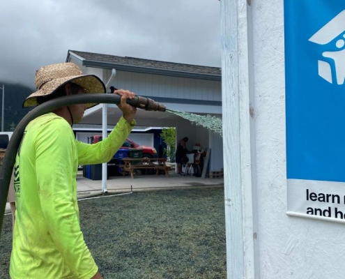 Big Island landscaper sprays lawn with Hydroseed mixture.